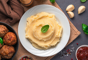 Lunch with mashed potatoes on a dark background.
