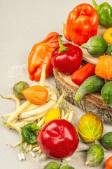 Trendy ugly organic vegetables and fruits on stone concrete background