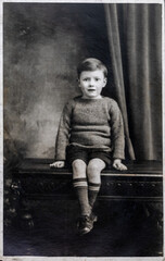 Vinatge photo of a small boy, aged 5 years. Circa 1933.