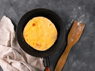 Homemade corn flatbread meal frying pan linen cloth. Handmade mexican tortilla for wrapping. Traditional latin cornmeal dough bread top view Authentic cuisine Taco Quesadilla cooking recipe ingredient