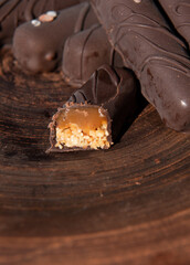 Chocolate candy with caramel and nuts. Close-up. Copy space.