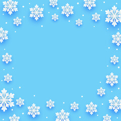 Paper snowflakes Christmas frame on blue background for winter holidays design