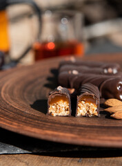 Chocolate candy with caramel and nuts. Close-up. Copy space.