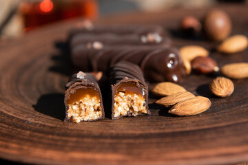 Chocolate candy with caramel and nuts. Close-up. Copy space.