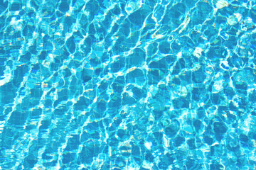 Fototapeta na wymiar Surface of blue water in the pool, top view. Сopy space. Template for your design.