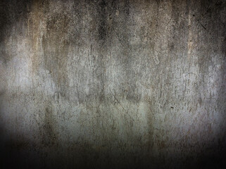 The old rough-textured concrete walls are dotted with black and white with little detail