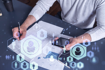 A potential employee signing the contract to boost his career and gain new opportunities in personal growth. Concept of success. Checking the detail of the deal at smartphone. Social media icons