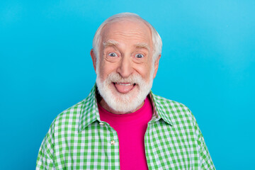 Photo of funny funky cool retired old grandpa stick out tongue good mood isolated on pastel blue color background