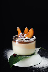 Panna cotta sweet dessert creamy on black background dark photo