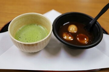 Japanese warm matcha and shiratama dumplings. Japanese hot dessert in autumn.