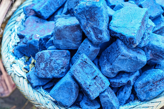 Blue indigo color stones displayed at traditional souk - street market in Marrakech, Morocco, closeup detail