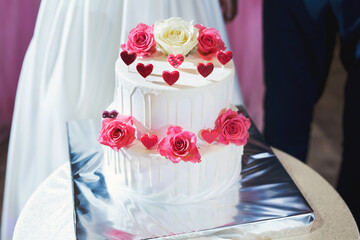 Beautiful wedding cake for the newlyweds at the wedding. A birthday cake at a banquet.