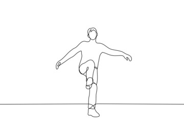 man stands swinging his leg for a kick - one line drawing vector. concept of kick it, rush in, open door with foot, aggression,  balance on one leg