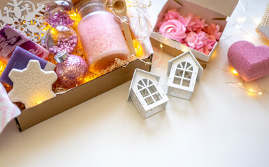 Preparing self care package. Small business, ethical shopping idea. Presents packed in plastic free, craft gift boxes.