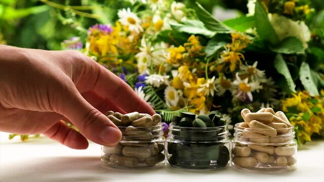 Medicinal herbal extracts and dietary supplements. Selective focus.