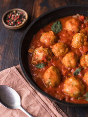 Meatballs in tomato sauce in a frying pan