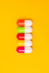 Top view of colorful capsule pills. Pharmaceutical industry. Healthcare background. Online pharmacy concept