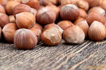 whole hazelnuts on a wooden table,in shell
