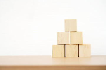 pyramid of blank square wooden cube  for create icon symbol to success, goal or target, business, health insurance, medical concept