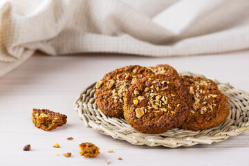 Homemade cereal cookies on a wicker stand. Sugar, gluten, lactose free, vegan.