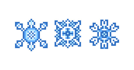 Obraz premium Set of 3 blue pixel art snowflakes isolated on white background. 8 bit weather icons. Decorative winter ornaments.Christmas, New Year symbols, vector clip art.Holiday design elements.2d game graphics.