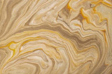 Abstract fluid art background light brown and golden colors. Liquid marble. Acrylic painting with beige gradient.