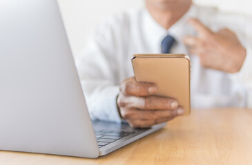 businessman using smartphone and laptop 