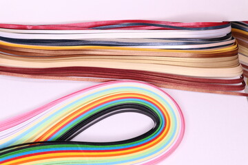 Different type of quilling paper on a white background