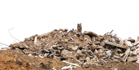 Wreckage of a demolished building at a construction site isolated on white background. Pieces of concrete, wall fragments, broken bricks, steel reinforcement, dust and dirt and other debris