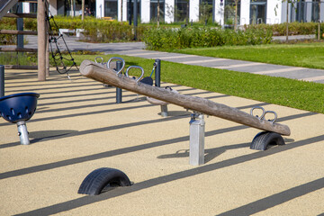 Children's playground with a safe rubber coating in the courtyard of a modern residential complex....