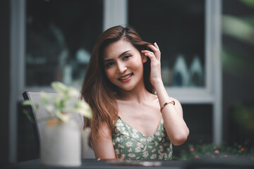 Portrait of young Asian beautiful cute girl in cafe, lifestyle concept.