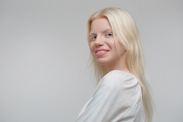 Cute blond scandinavian woman isolated on gray background. - obrazy, fototapety, plakaty