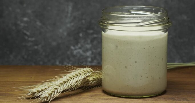 Homemade sourdough starter for baking bread. Timelapse 4k.