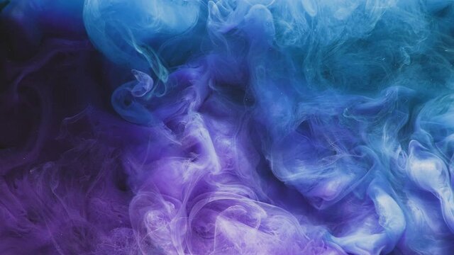 Color vapor flow. Ink water mix. Fantasy sky flare. Blue purple glitter particles smoke cloud spreading on dark abstract art layer background effect for intro.