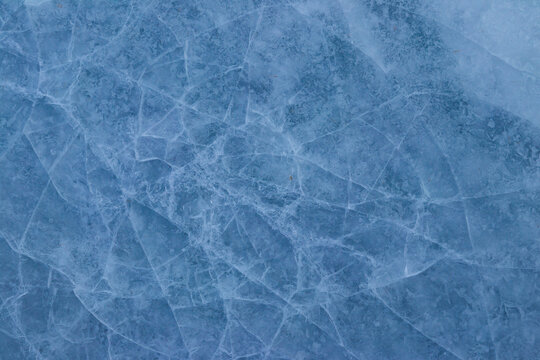 Texture of the cracked ice. Winter background