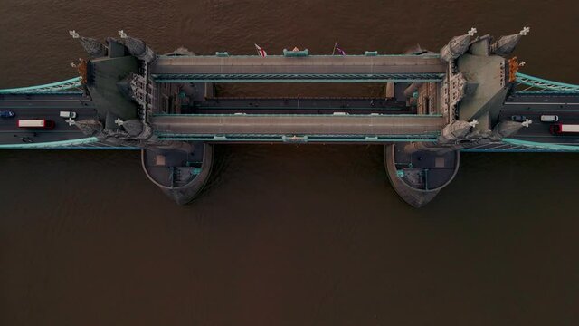 Aerial top down view to the iconic Tower Bridge over river Thames from drone. Traffic going across the bridge.