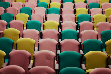 Fototapeta premium Assortment of colorful seats seen in auditorium