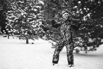 Fototapeta na wymiar Woman skiing at ski resort wearing equipment