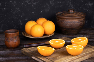Orange fruits on a wooden background. Healthy food. Vitamins and food. Slice of orange 