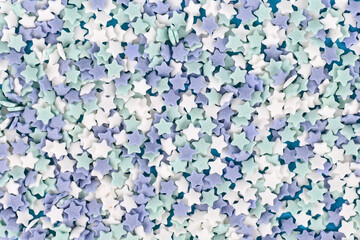 Star shaped sugar sprinkles with blue, teal and white color