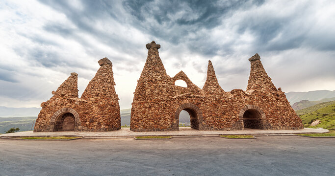 Monument near the road, dedicated to ancient cave dwellings carved out of soft volcanic tuff rocks, that is the main attraction of Goris town in Armenia.