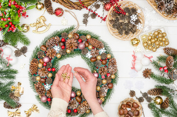 Step-by-step making a large Christmas wreath, step 18 - take and glue gold beads on hot glue