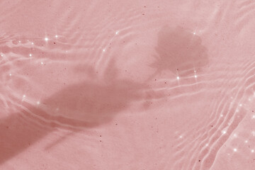 Fototapeta premium Aesthetic background, rose shadow with sparkle, water ripple texture