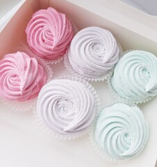 Homemade marshmallows in a white box. Marshmallow roses. A close-up shot.