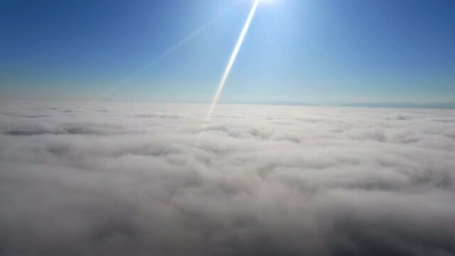 Flying in the clouds flying in the clouds. The clouds are moving on camera. Flying through the cloud