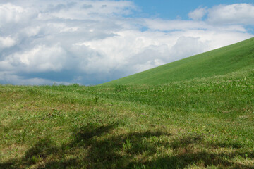 italian mountains landscape with green meadow