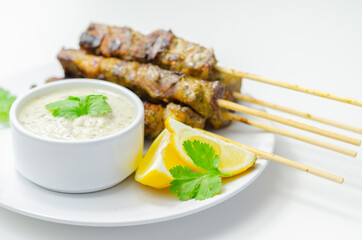 Pork shoulder kebabs with a lemon and herb rub and a garlic and mint yogurt sauce