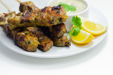 Pork shoulder kebabs with a lemon and herb rub and a garlic and mint yogurt sauce