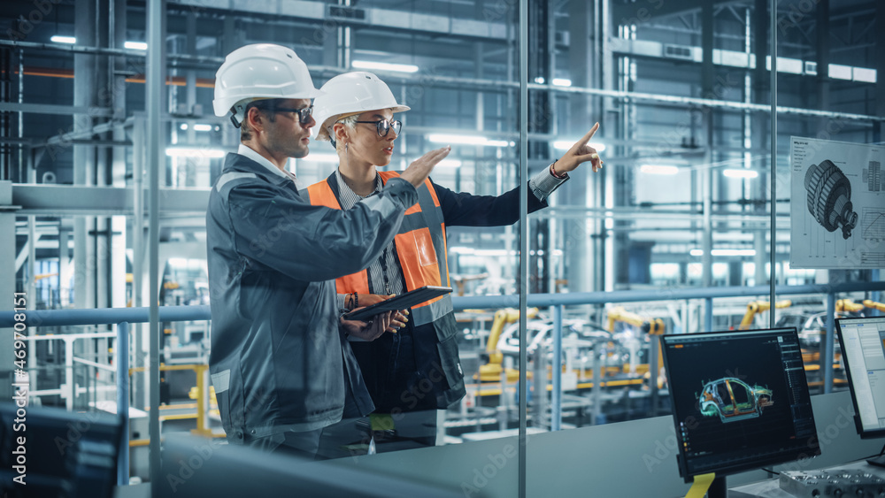 Aufkleber male engineer and female industrial product designer discuss work while using tablet in office at a 