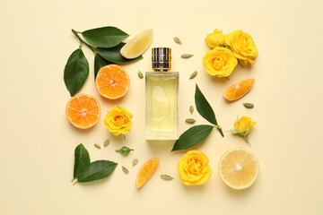 Flat lay composition with bottle of perfume and fresh citrus fruits on beige background - obrazy, fototapety, plakaty